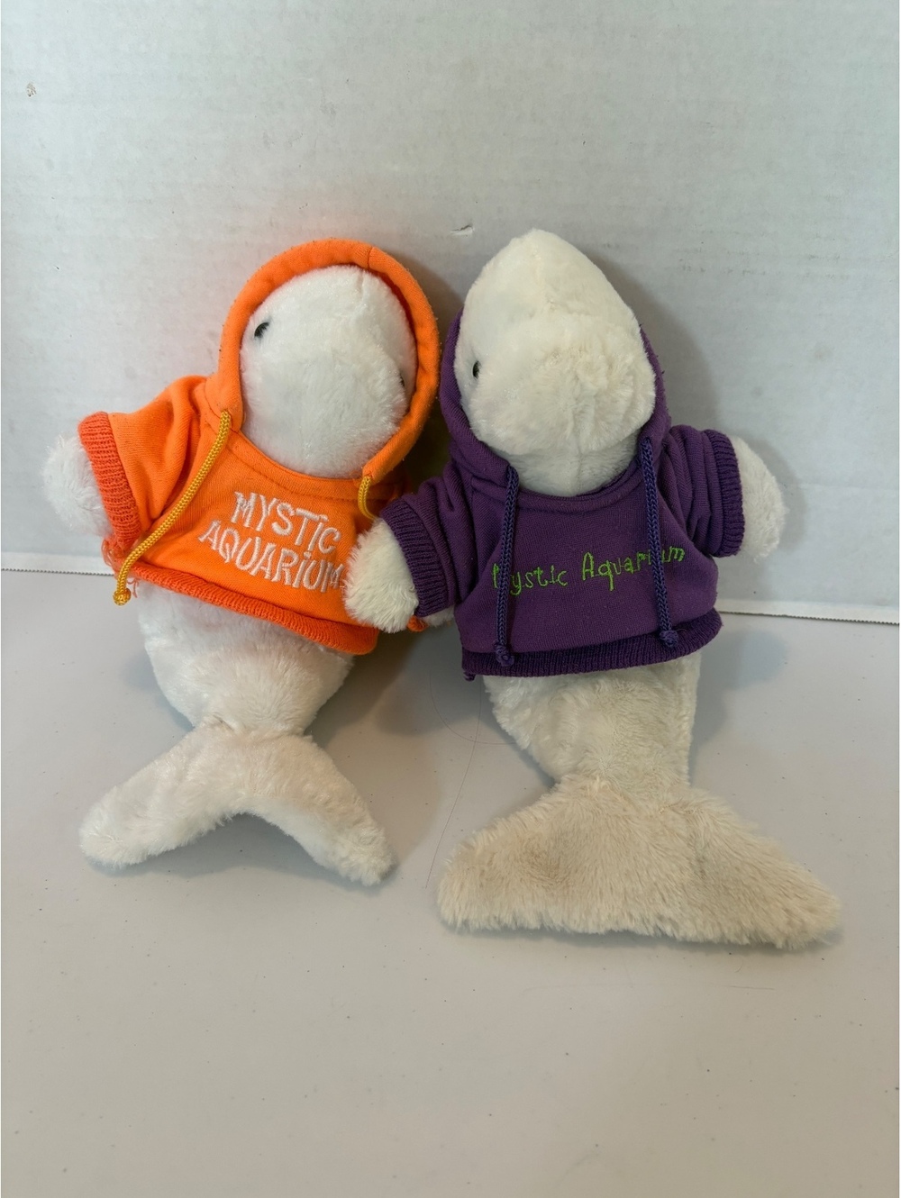 Two mystic whale stuffed animals